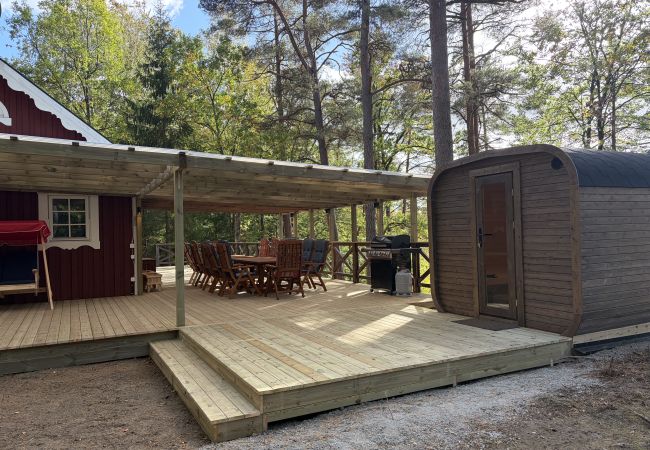 House in Bjärnum - 2 holiday homes with sauna and whirlpool directly on the lake
