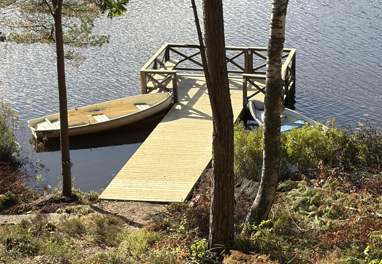 House in Bjärnum - 2 holiday homes with sauna and whirlpool directly on the lake