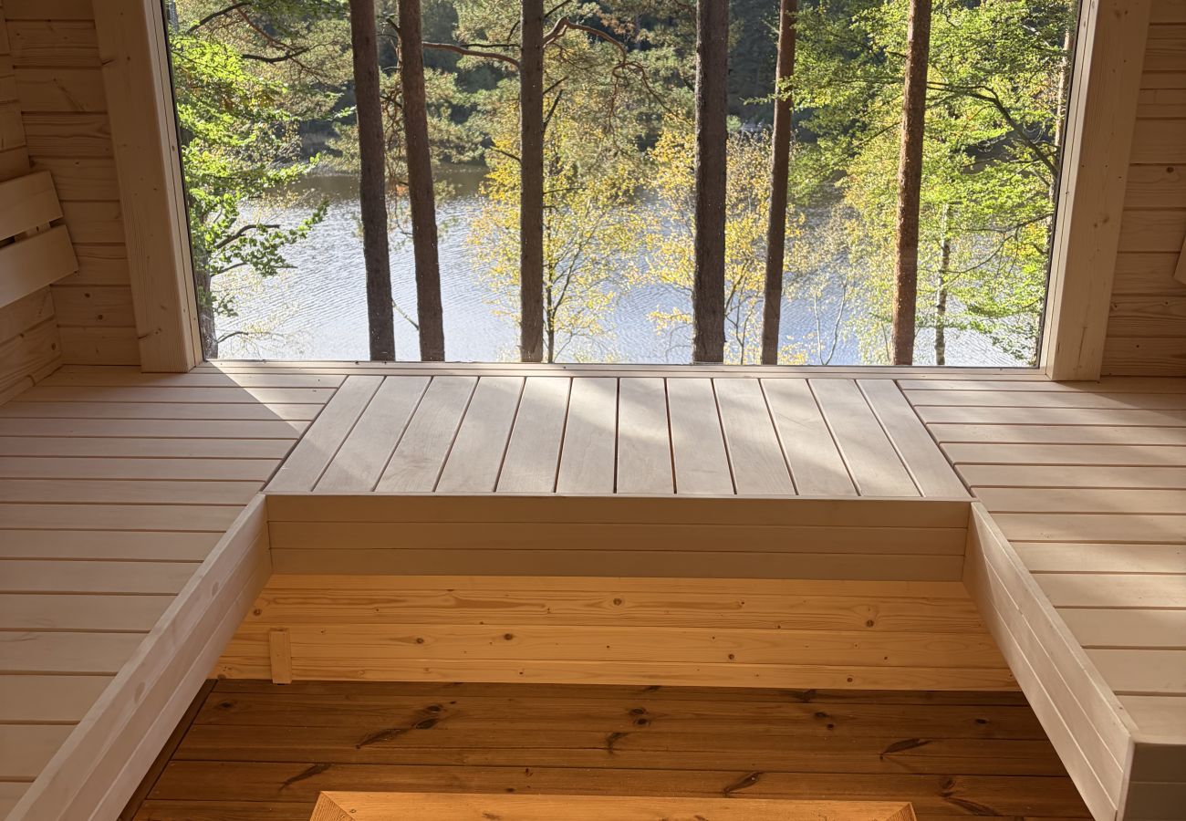 House in Bjärnum - 2 holiday homes with sauna and whirlpool directly on the lake