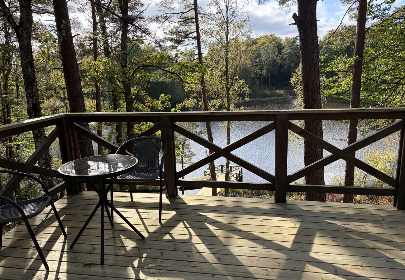 House in Bjärnum - 2 holiday homes with sauna and whirlpool directly on the lake
