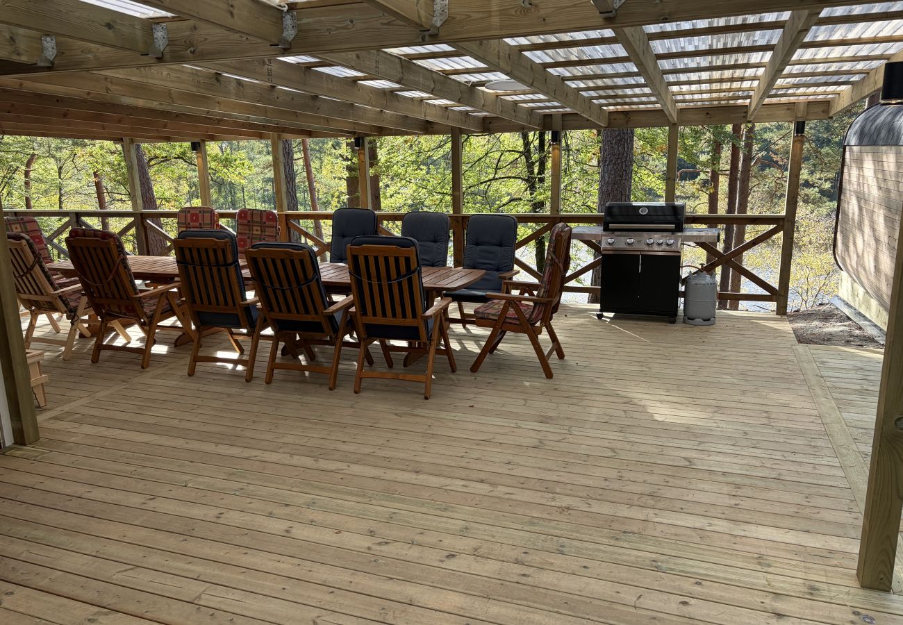 House in Bjärnum - 2 holiday homes with sauna and whirlpool directly on the lake