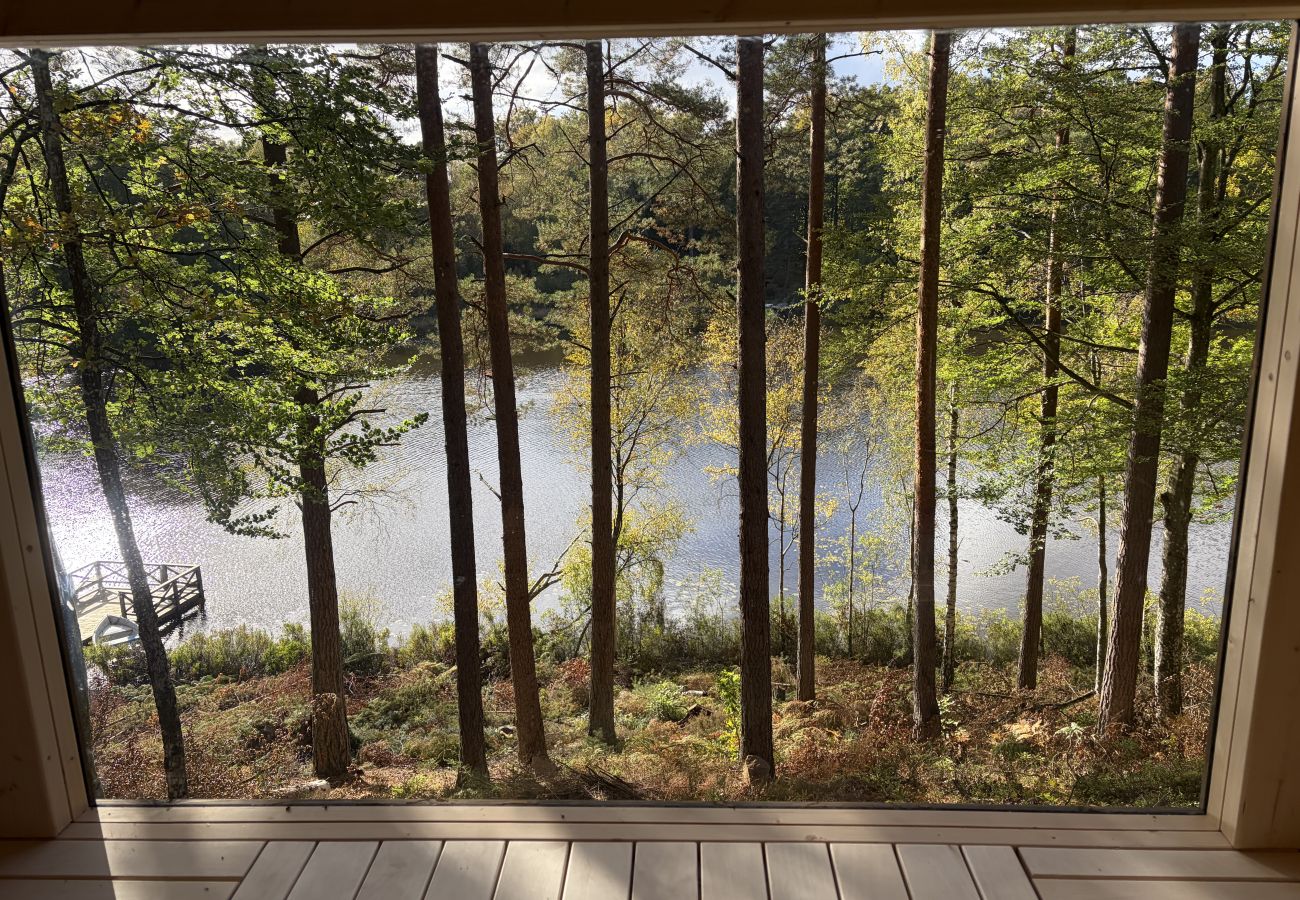 House in Bjärnum - 2 holiday homes with sauna and whirlpool directly on the lake