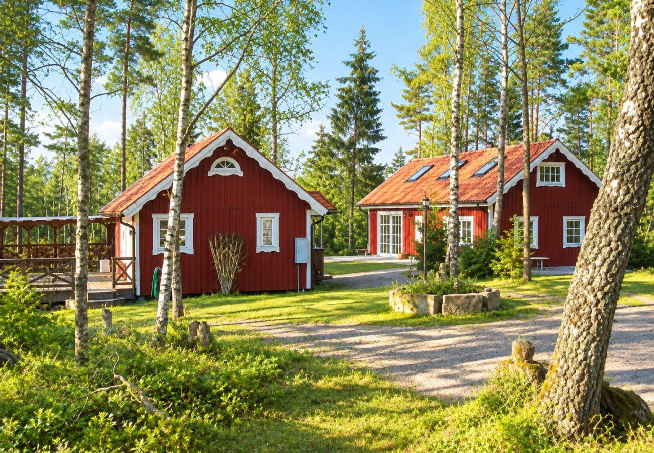 House in Bjärnum - 2 holiday homes with sauna and whirlpool directly on the lake