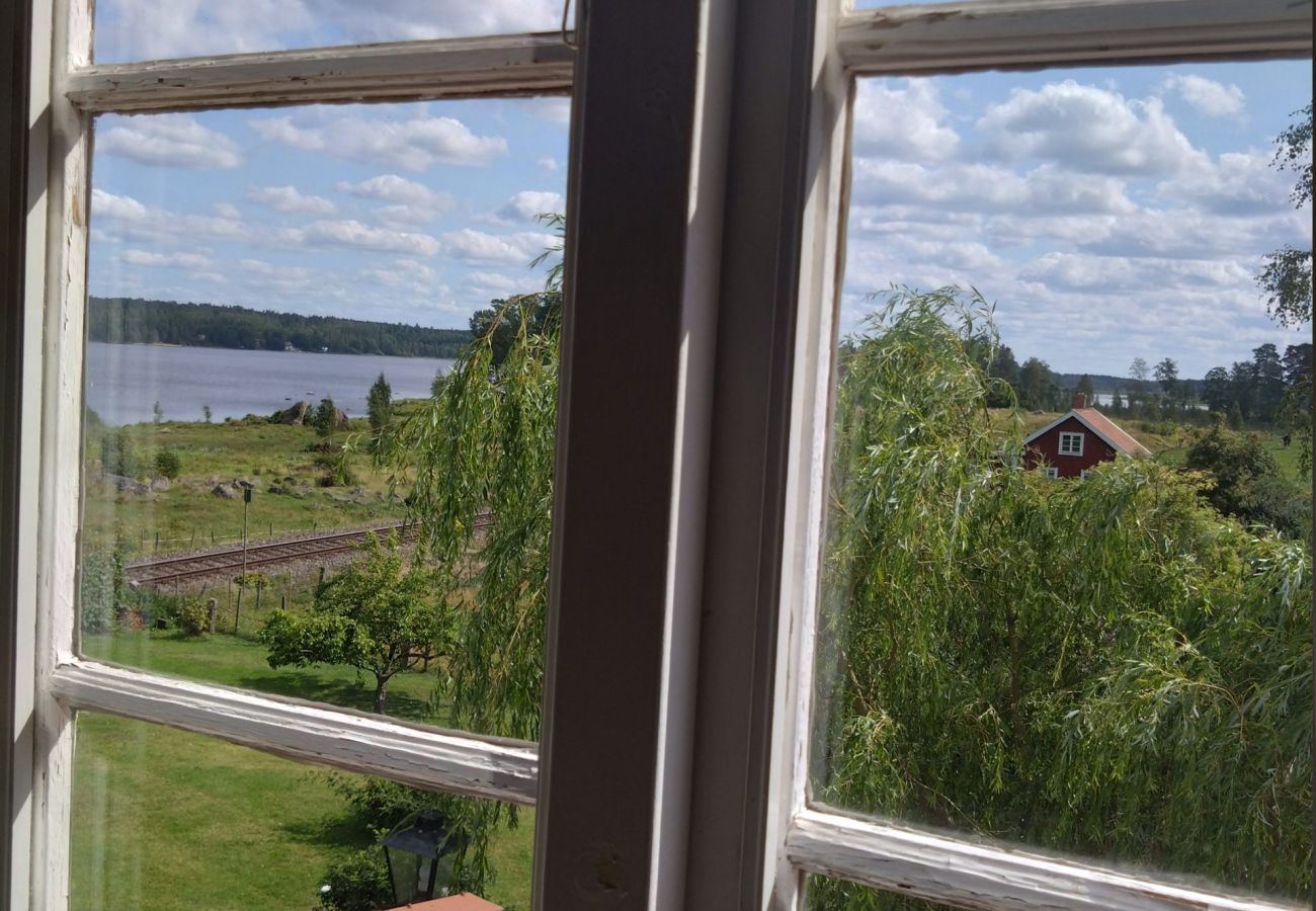 House in Södra VI - Charming red and white holiday home with lake view near Vimmerby